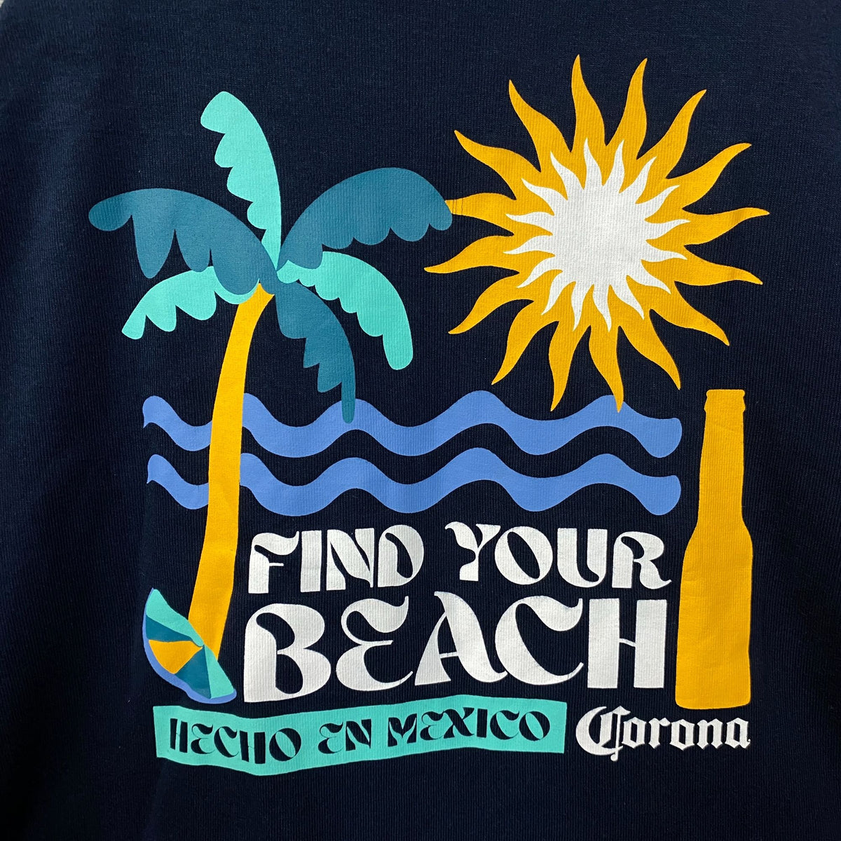 Corona Cerveza "Find Your Beach" Hecho En Mexico Raglan Crop Baby Tee XL